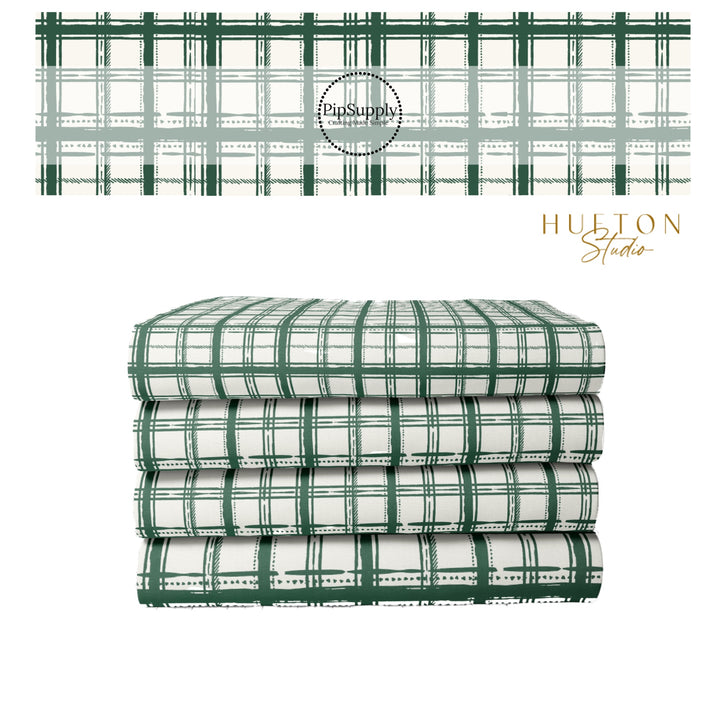 Green and white plaid fabric stack 