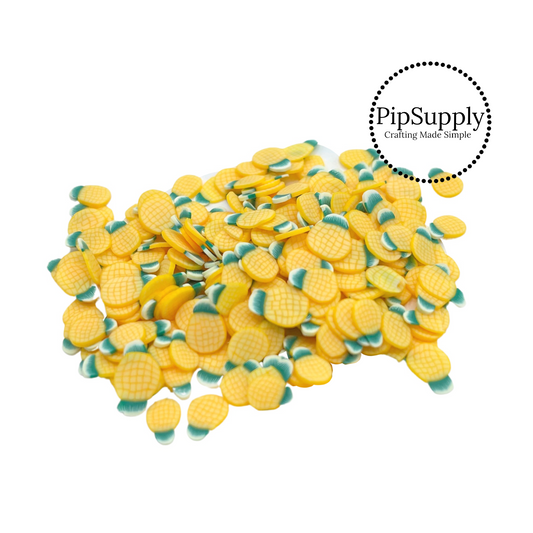 Summer polymer clay slices bright yellow pineapples.
