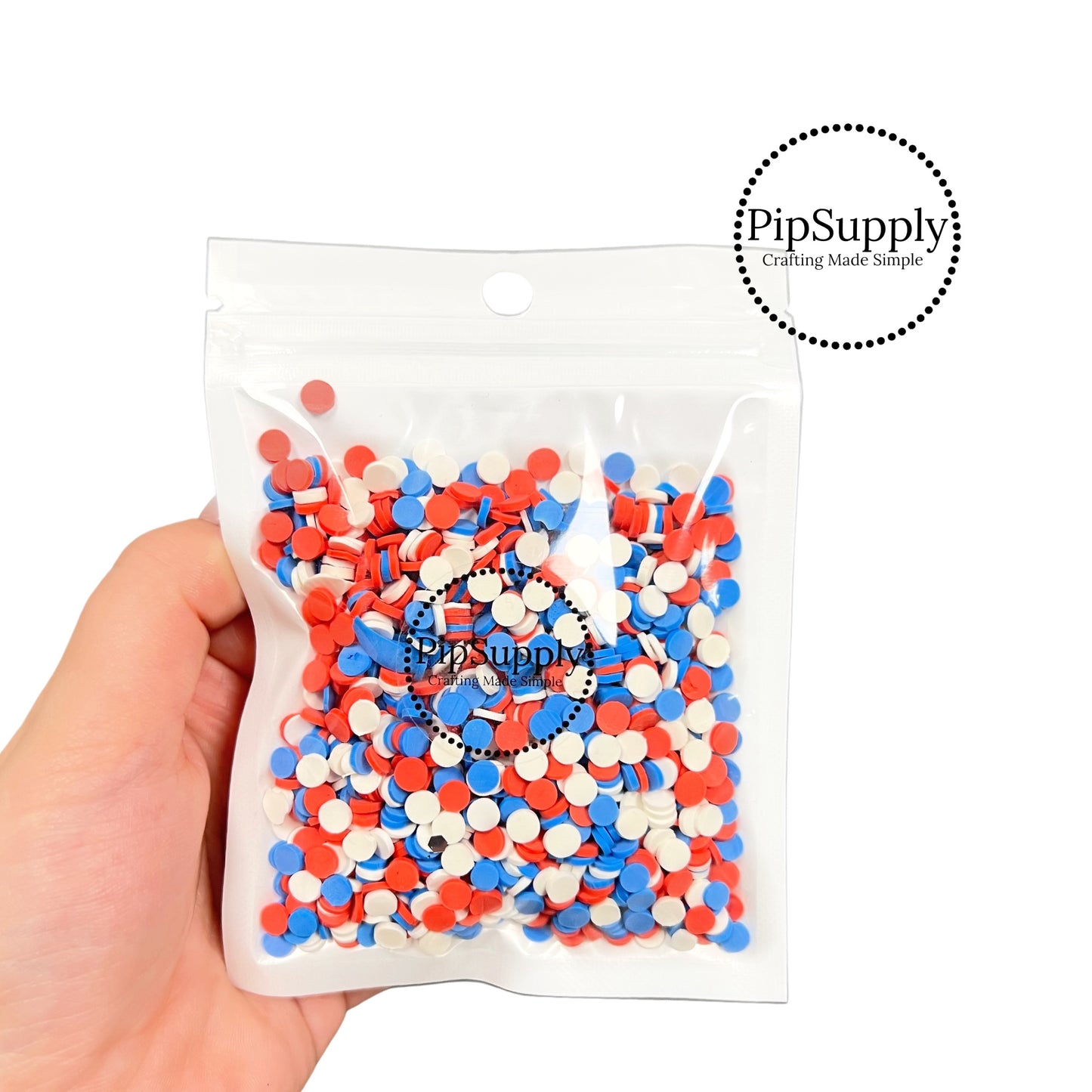 Full ounce bag of red, white, and blue loose glitter clay circles.