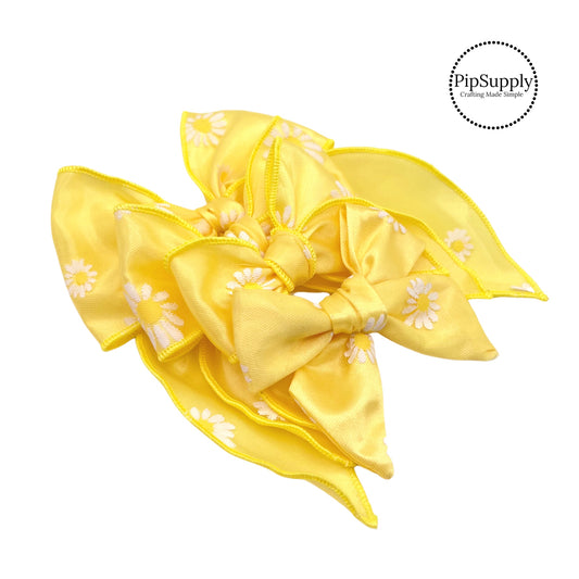 Yellow tulle bow with white daisies with yellow center bow strips