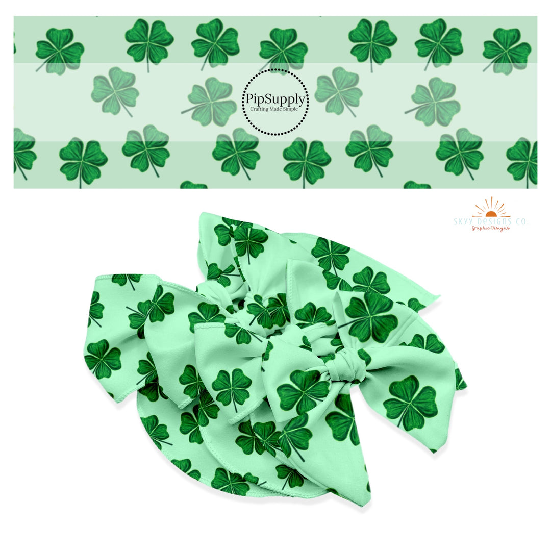 Emerald 4 leaf clovers on a light green bow strip