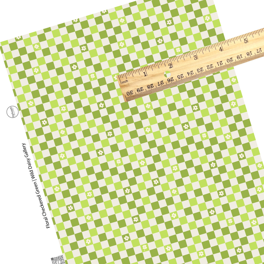 Flower and clover cutouts on green checkered faux leather sheets