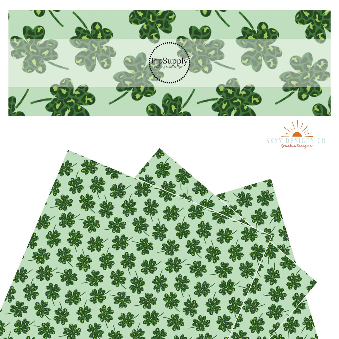 Green leopard spots in a green clover on a light green faux leather sheet