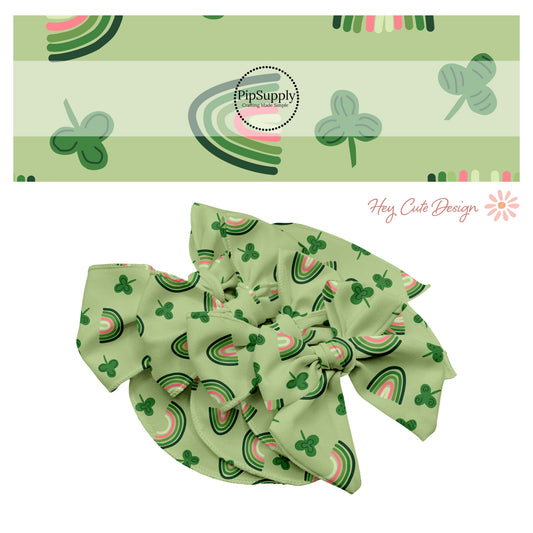 Clovers with black accents and polka dots with pink and green rainbows on a green bow strip