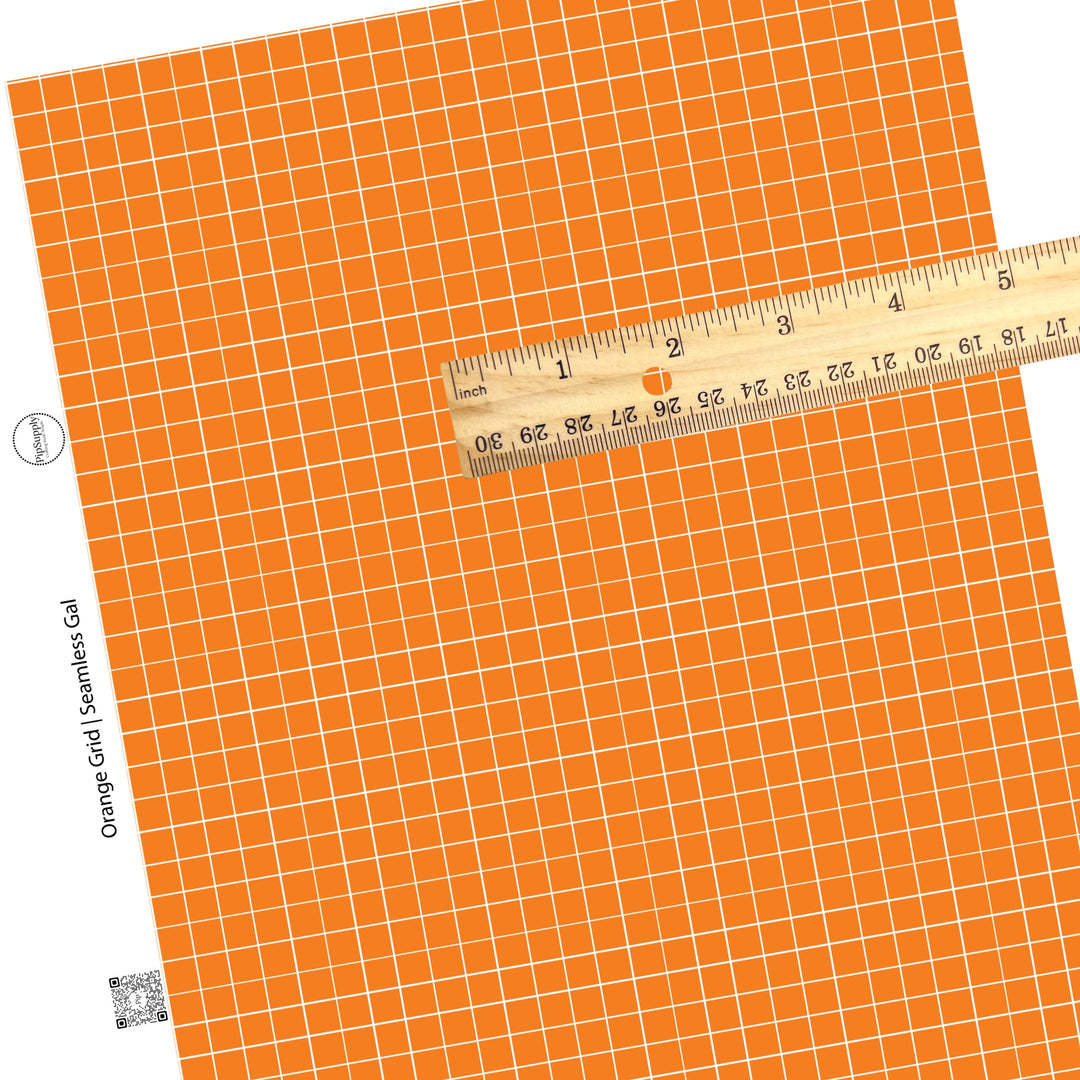 Grid patterned orange and white faux leather sheet.