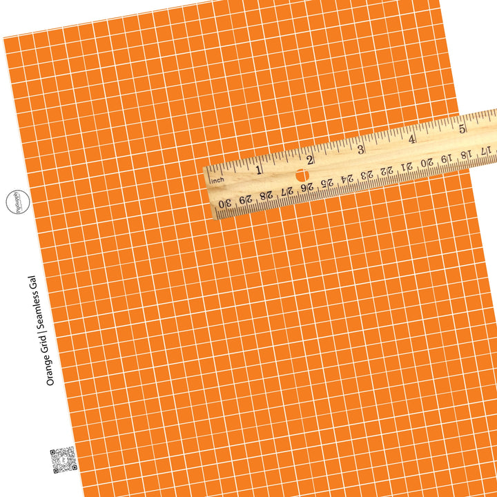 Grid patterned orange and white faux leather sheet.