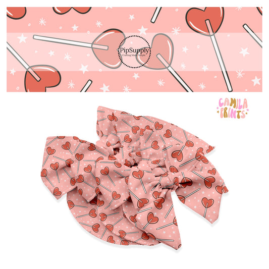 Red heart candy with white stars on pink bow strip