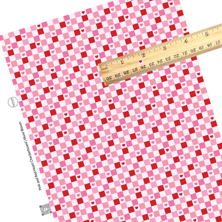 Red and pink tiles with red and pink hearts on a light pink checker print faux leather sheet