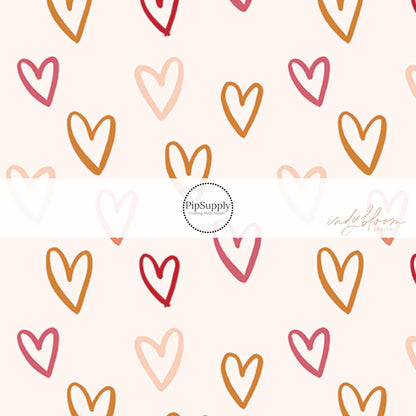 Gold, hot pink, and light pink hearts that are outlined on cream bow strips