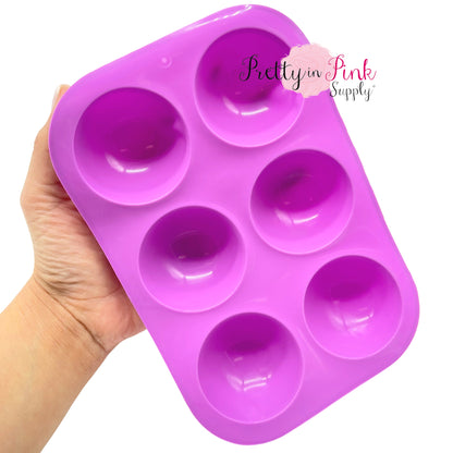 Pink food grade silicone mold for hot chocolate bombs.