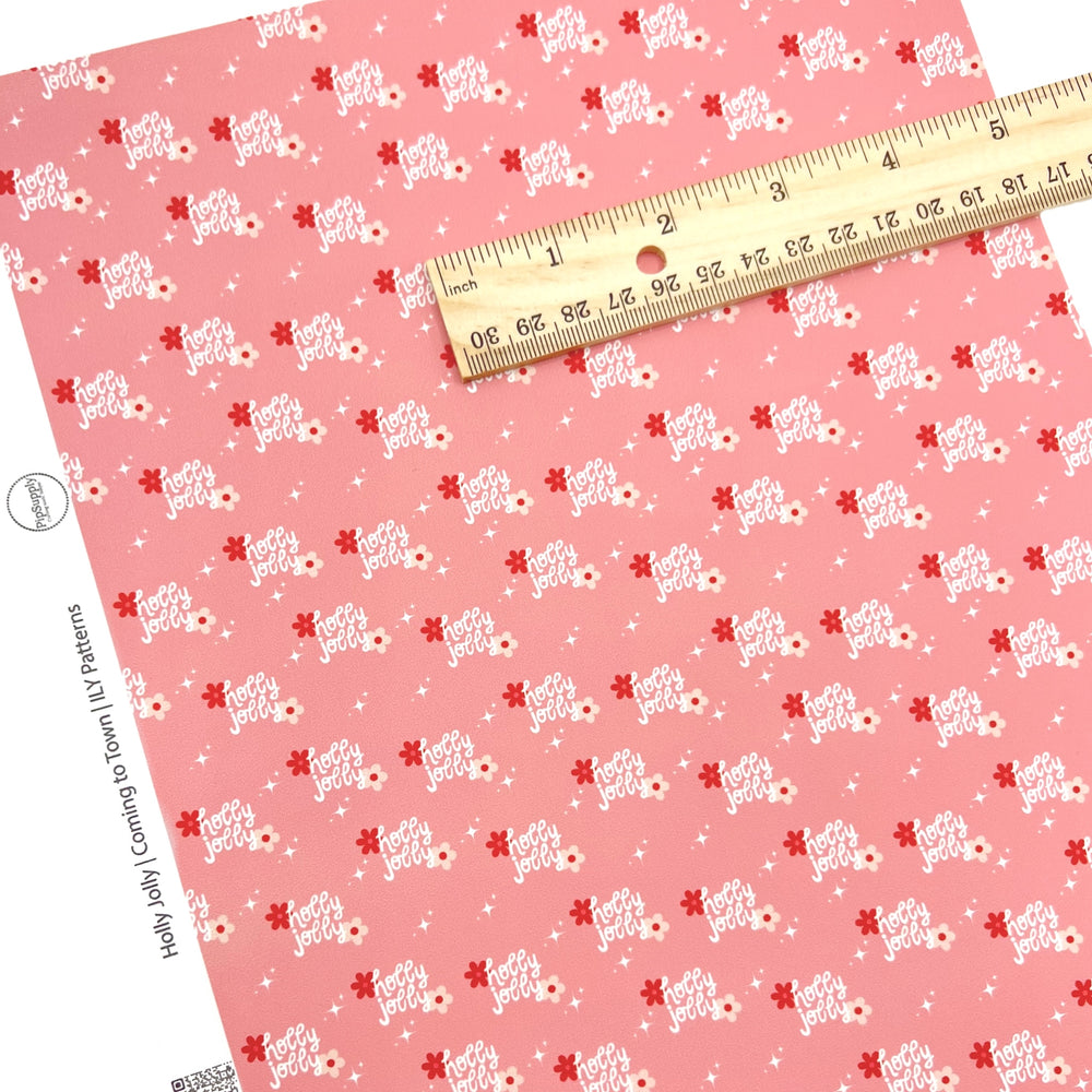 Christmas faux leather sheets with holly jolly words and flowers on a pink backgorund