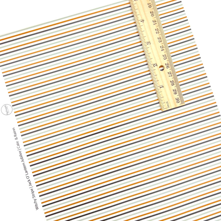 Orange, navy, and light blue stripes on white faux leather sheet