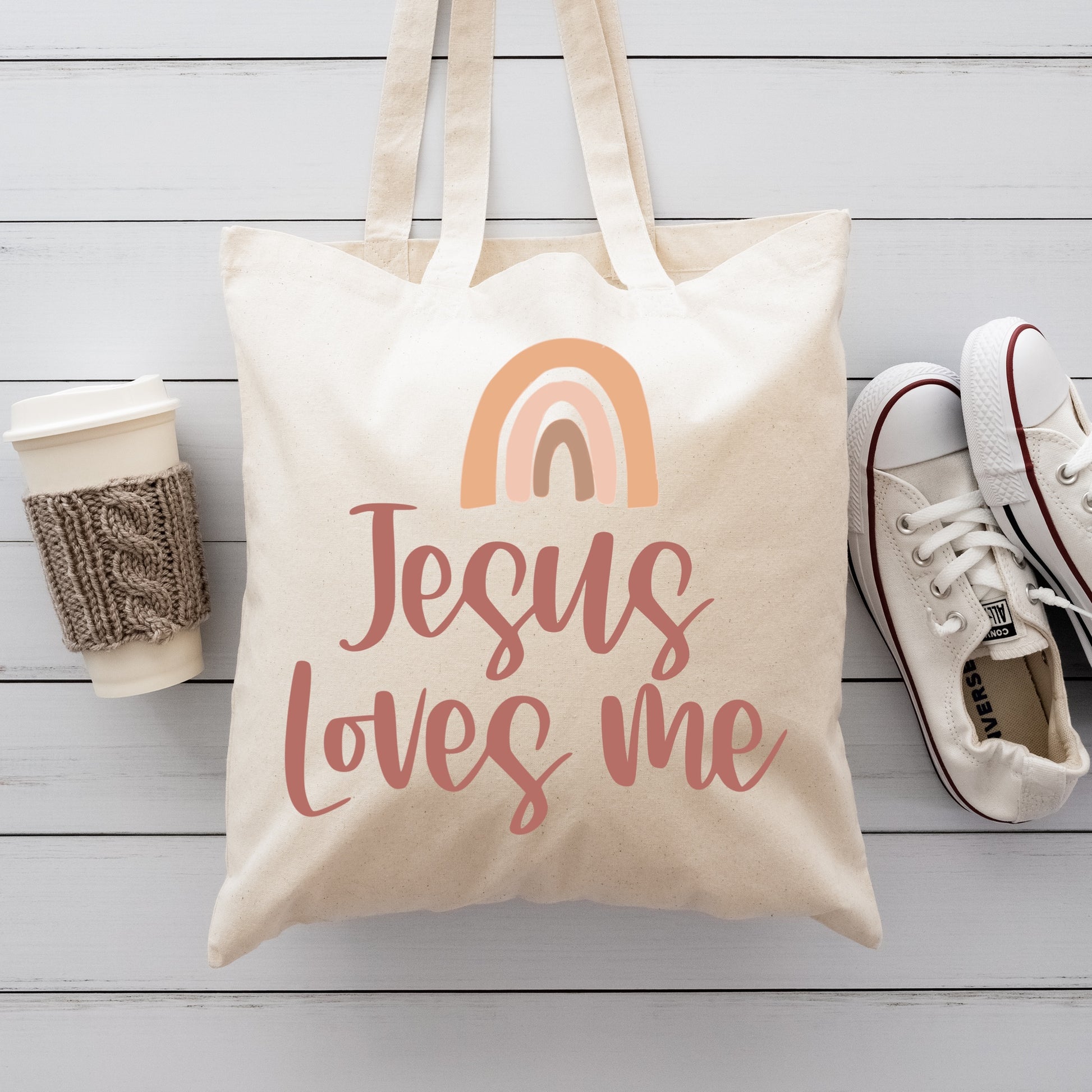 Tote Bag with a rainbow iron-on graphic that says "Jesus Loves Me" Iron on Transfer 