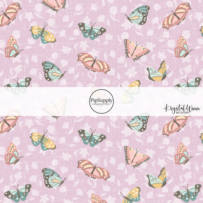 pink, blue, yellow butterflies with purple flowers on a lavender bow strip