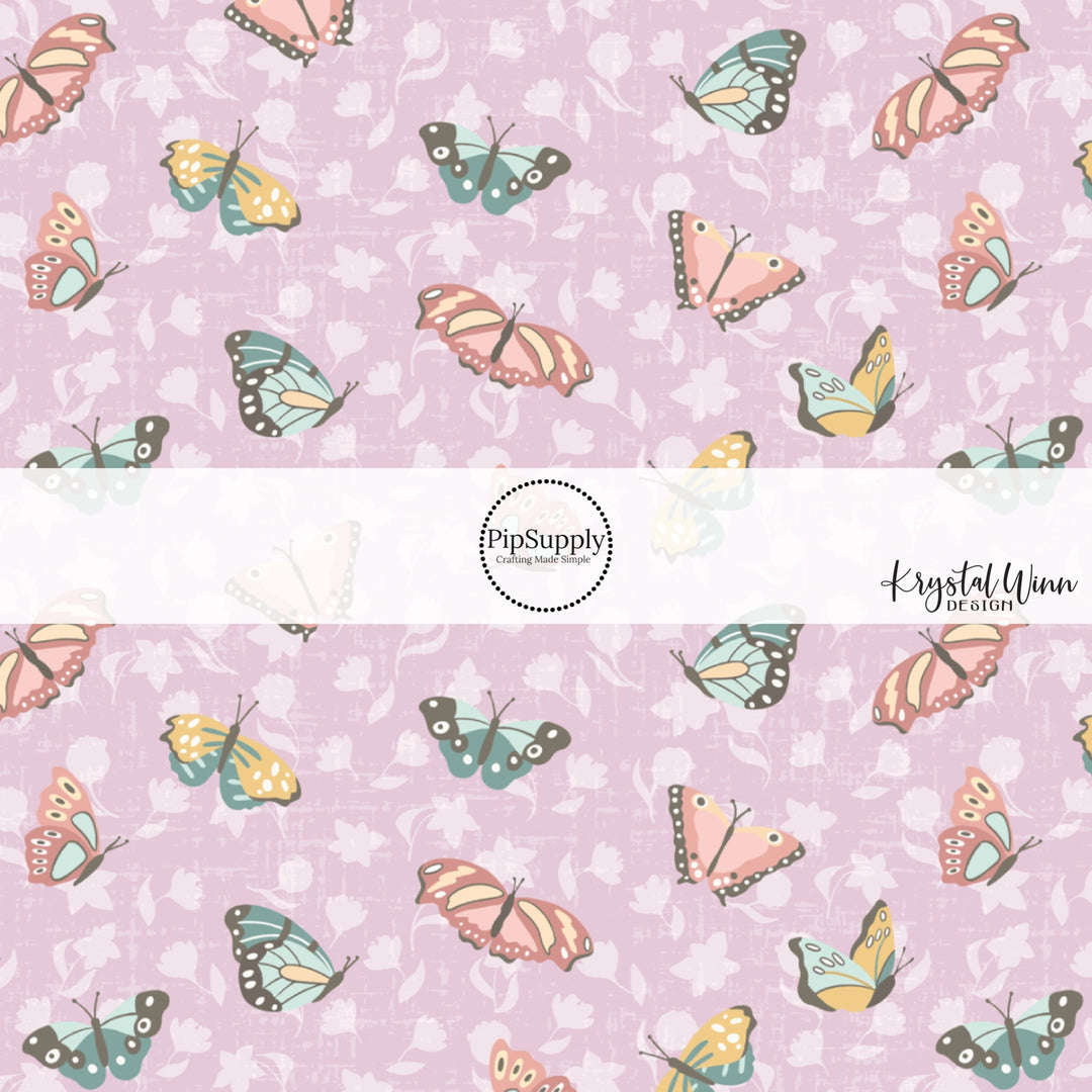 pink, blue, yellow butterflies with purple flowers on a lavender bow strip