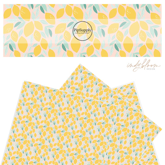 Mix of large an small bright yellow lemons on a pastel pink faux leather sheet.