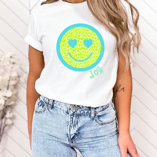 Lime smiley face heat transfer with a blue border and the word "joy"