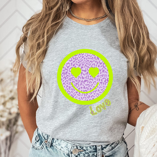 Purple leopard print smiley face with a lime green border and heart eyes. As well as the word "Love"