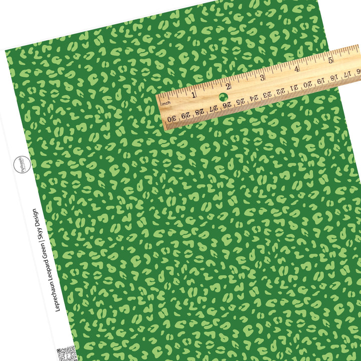 Green leopard spots on green faux leather sheet