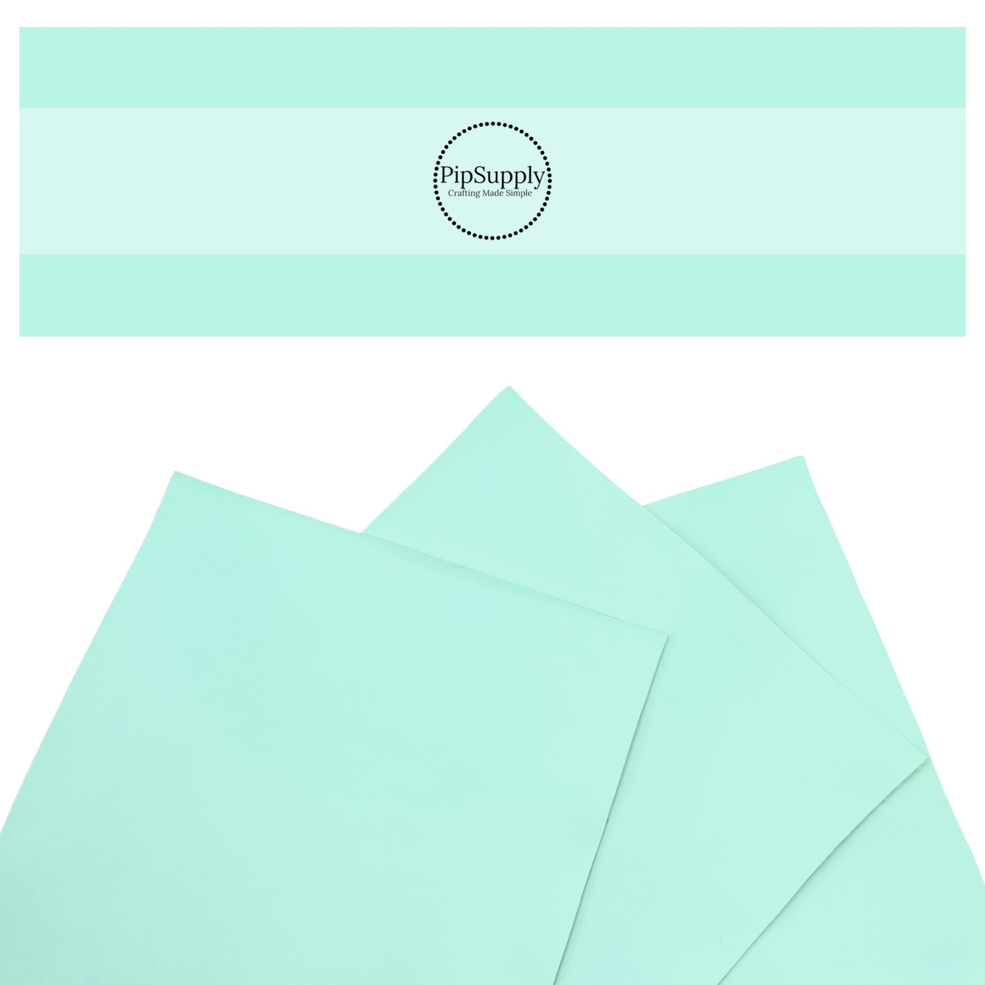 Smooth solid faux leather in light aqua.