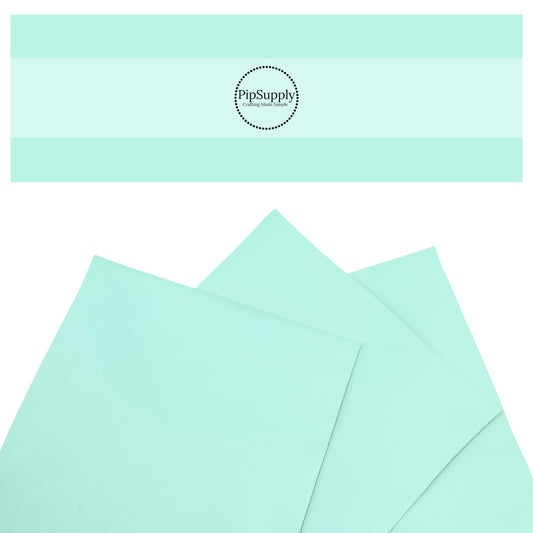 Smooth solid faux leather in light aqua.