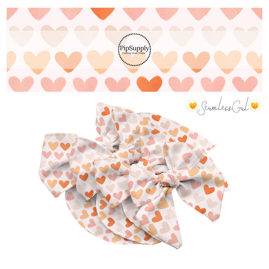 peach pink and light orange heart pattern on cream bow strips