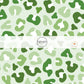 Mint green fabric by the yard with dark and light green leopard print