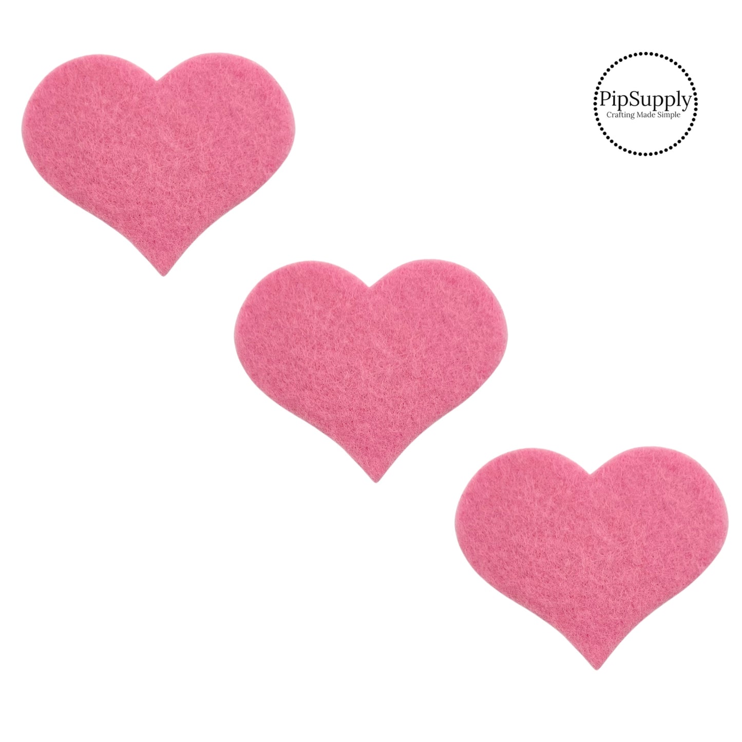 soft felt heart embellishment in light pink measuring about two inches tall and two and a half inches wide