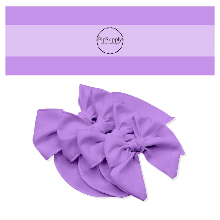 Tied spring Easter and Valentines Day solid color hair bow strips in lavender purple.