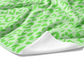 Plush white cotton towel with lime green and pastel green leopard animal print on the front.