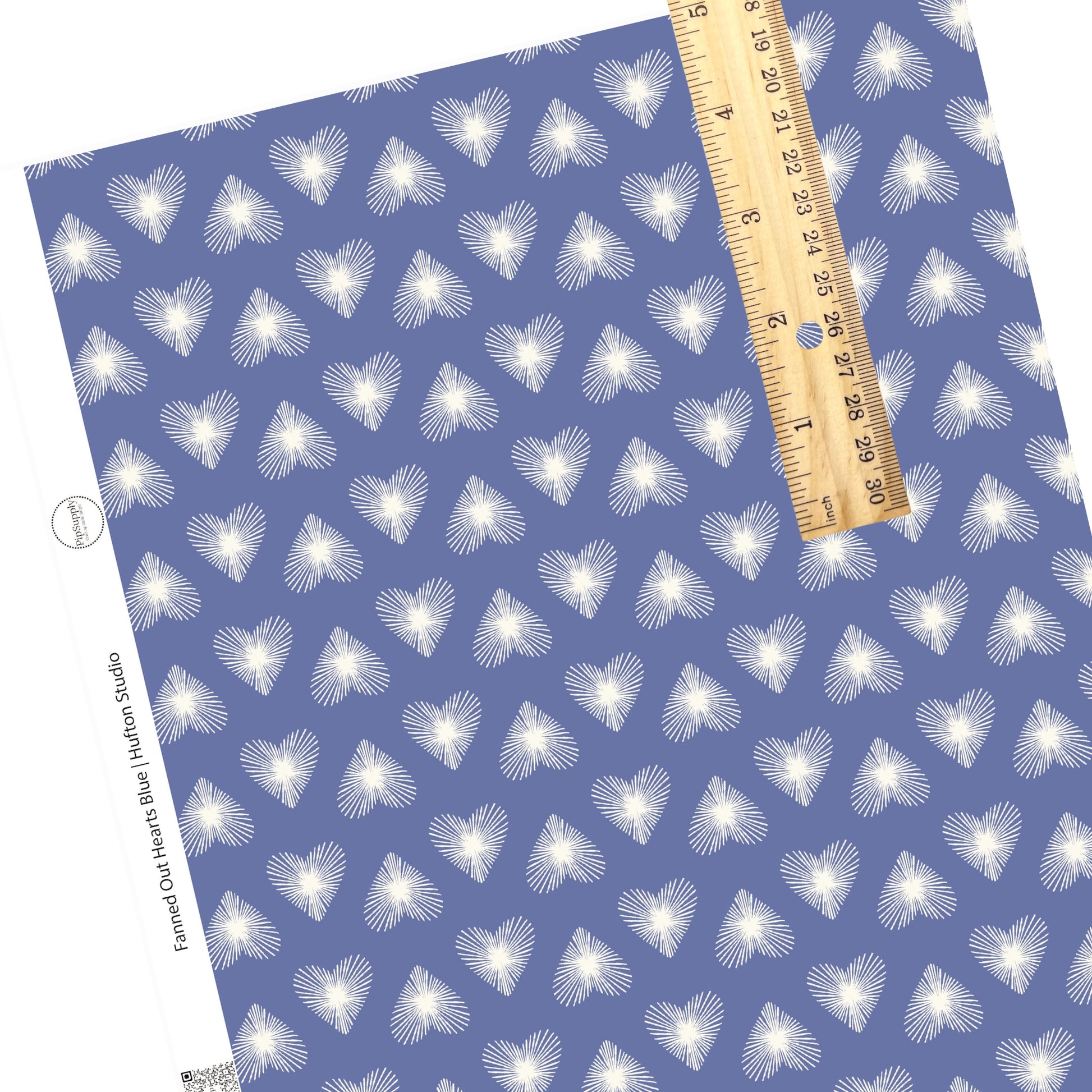 Scattered lined hearts in white on blue faux leather sheet