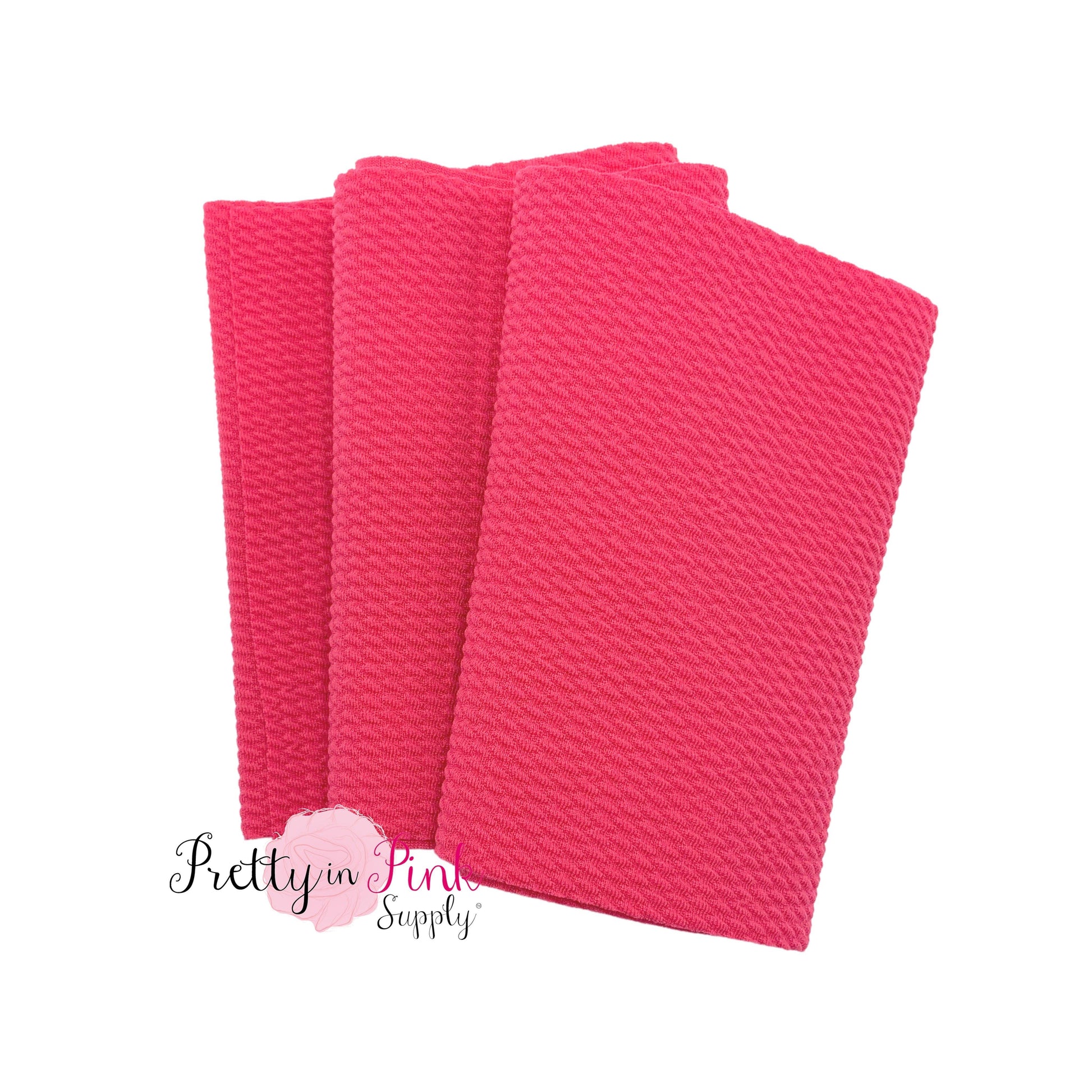 Folded over solid hot pink color textured, stretch liverpool fabric strip.