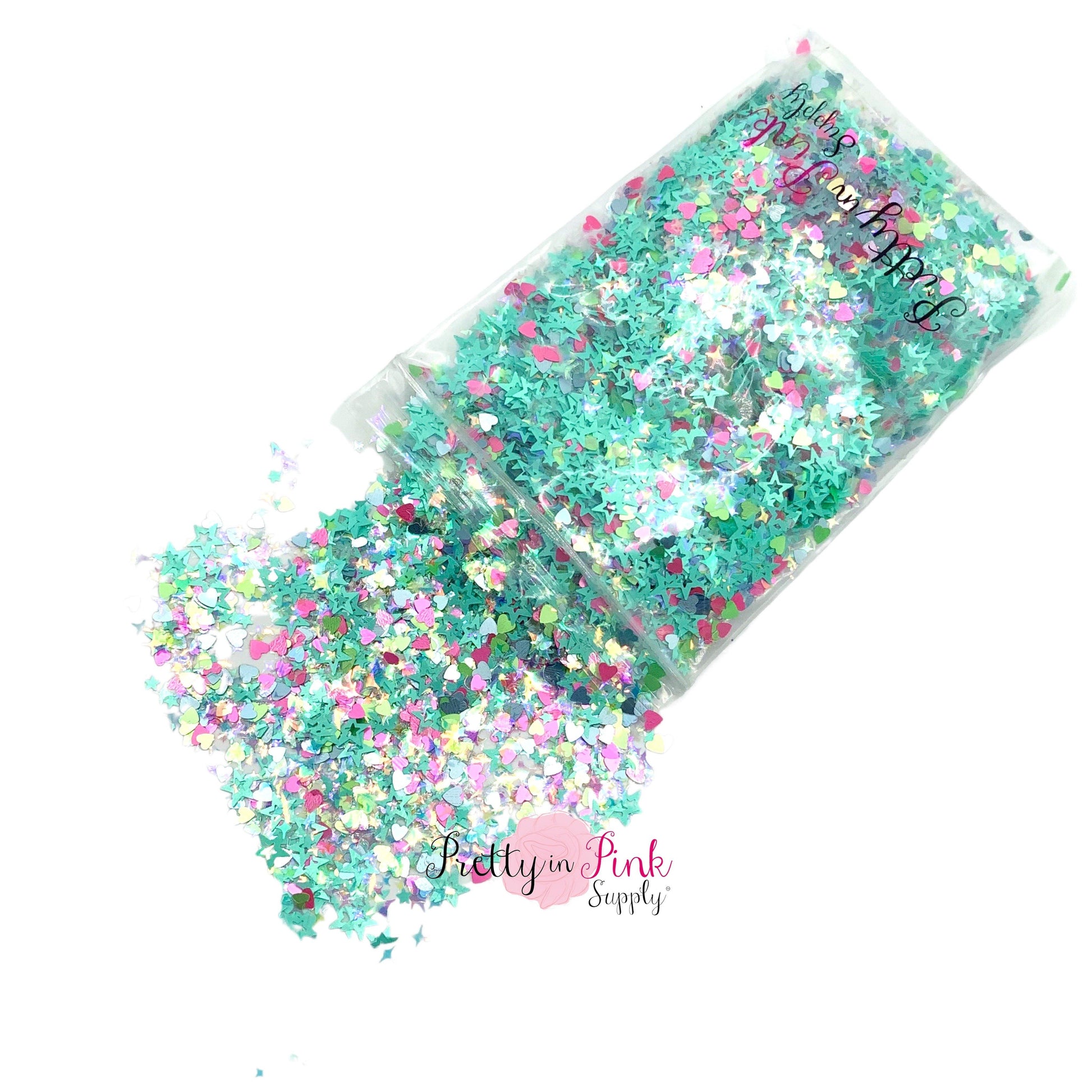 Spilling bag of light aqua and dark pink chunky glitter with star shapes and heart shapes.