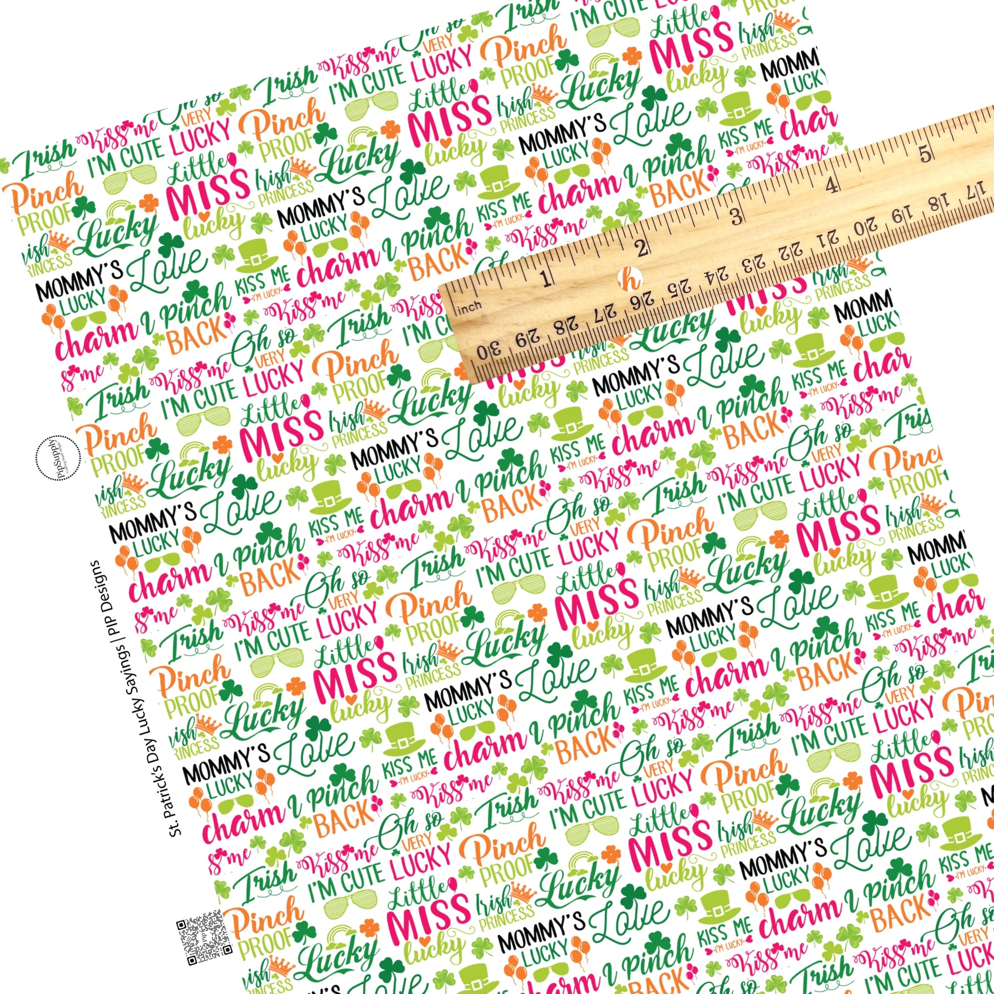 Pink, green, and black st patricks day word collage on white faux leather sheet