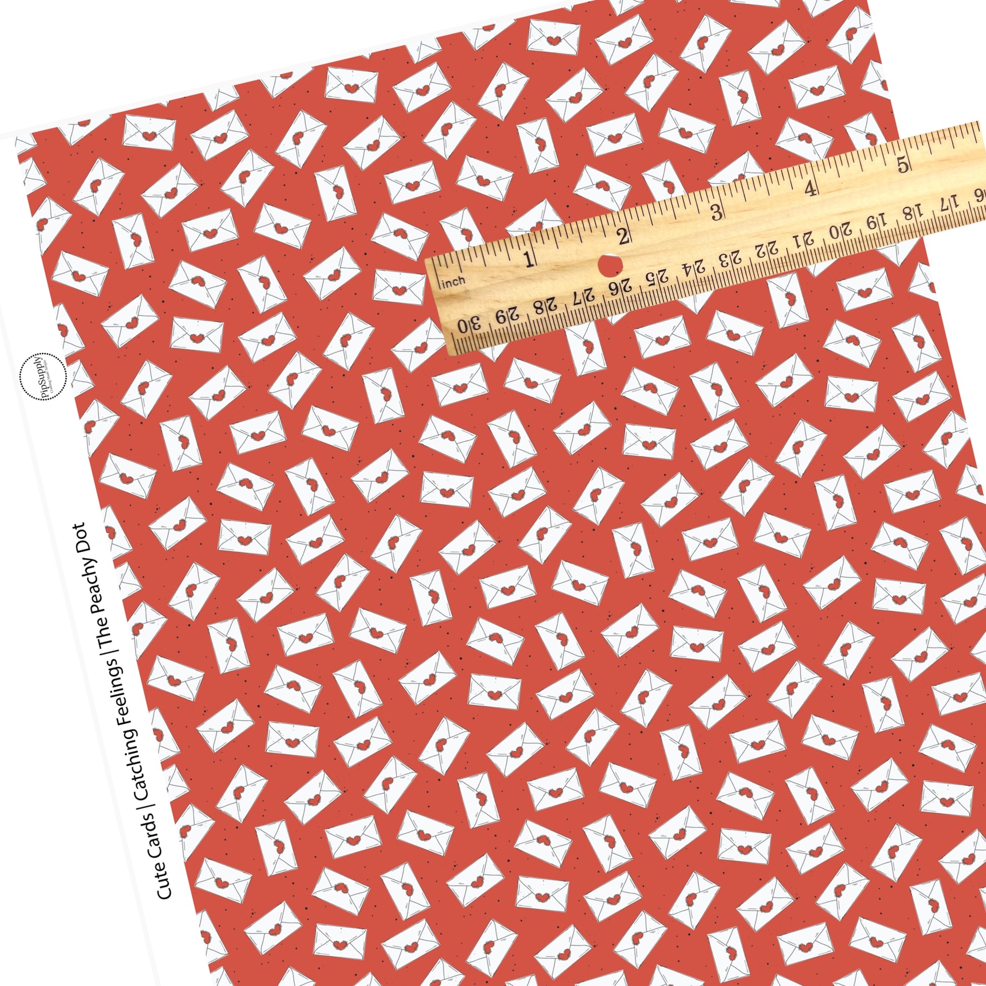 White mail with red hearts and black polka dots on red faux leather sheets