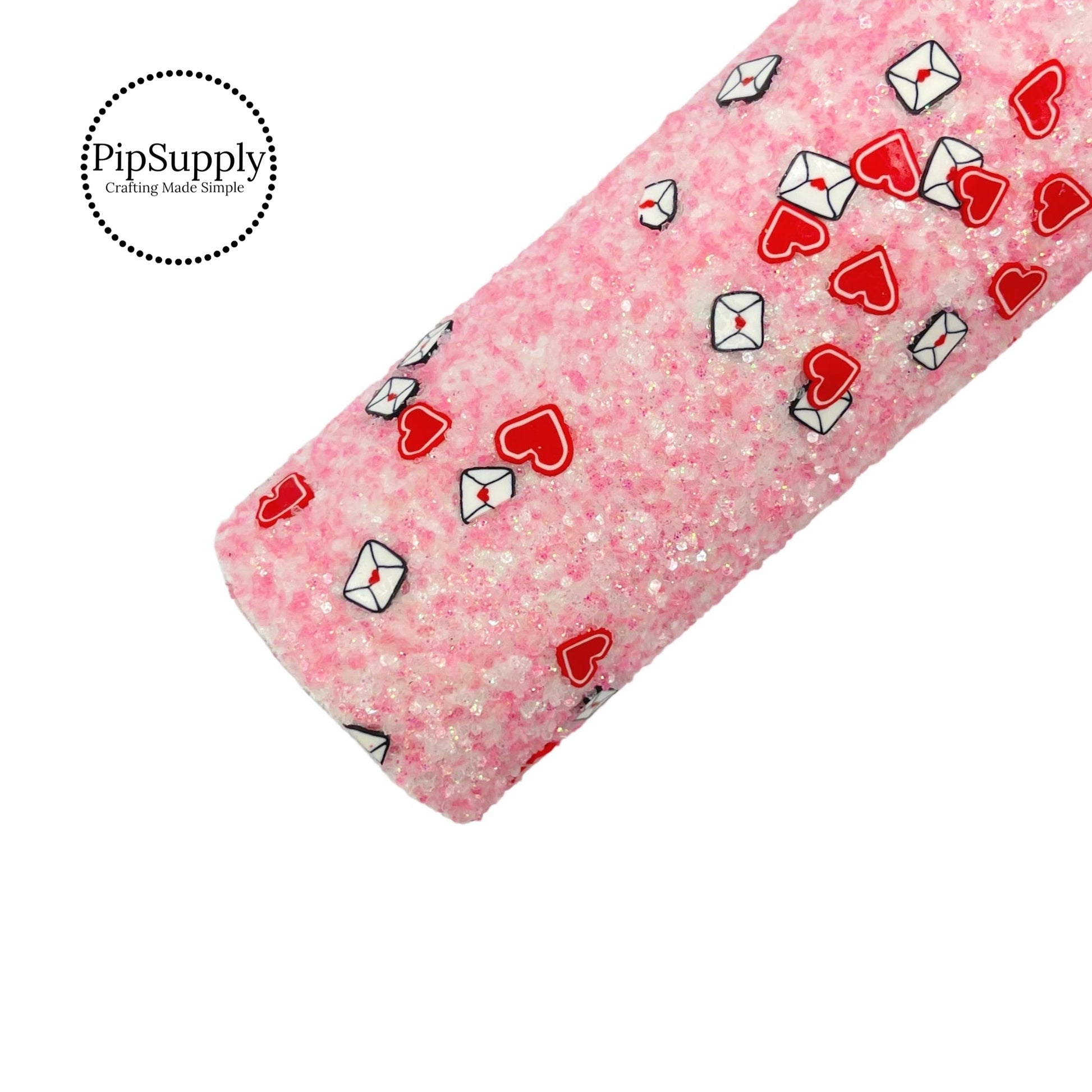pink chunky glitter sheet with red heart clays and black and white envelope clays