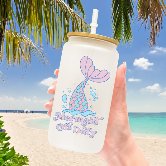 Mermaid tail in water and the phrase "Mermaid Off Duty" permanent adhesive sticker on a libby cup.