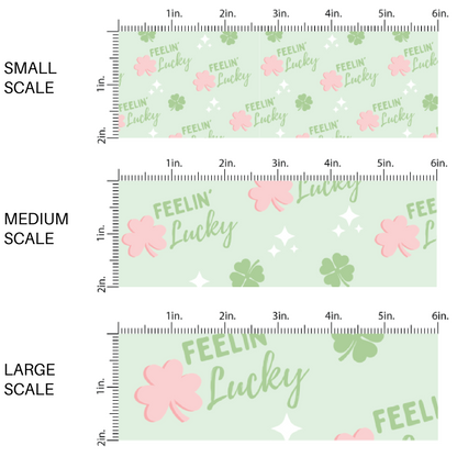 Scaled Image guide green fabric by the yard with pink and green shamrocks and the phrase "Feelin' Lucky"