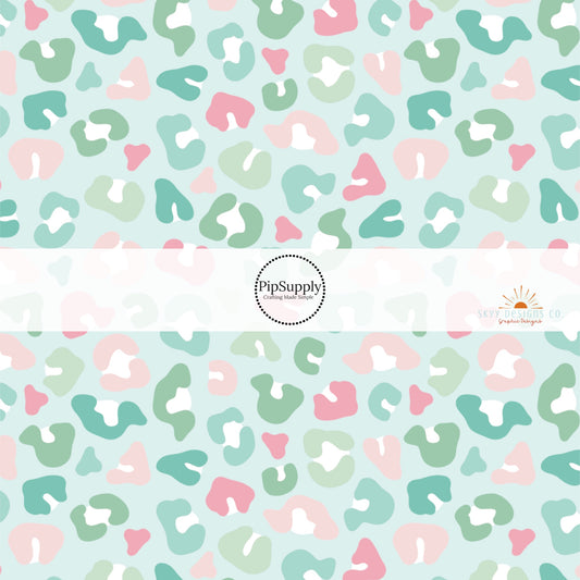Mint green fabric by the yard with pastel colored leopard print