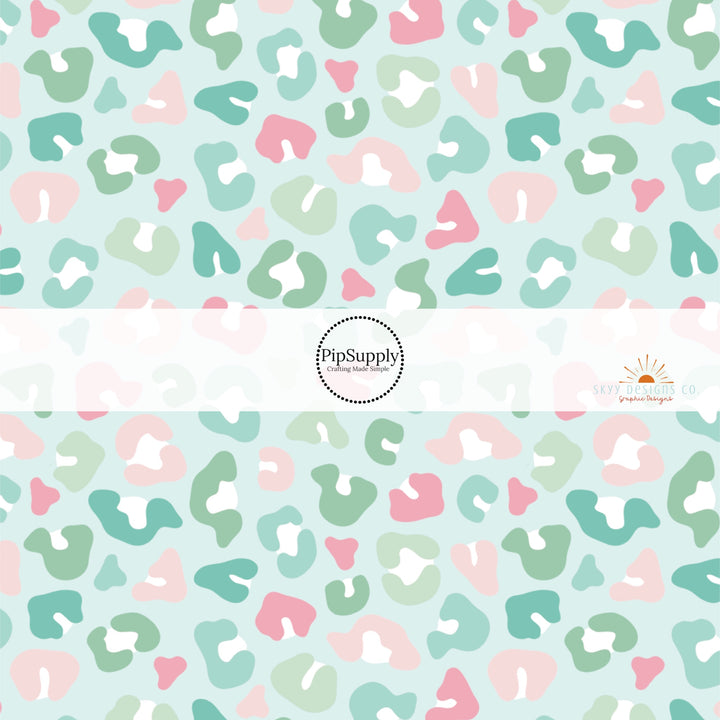 Mint green fabric by the yard with pastel colored leopard print