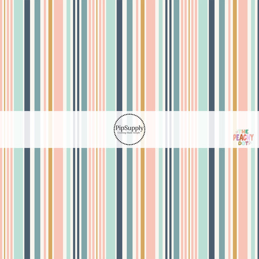 Yellow, navy blue, and pink stripes on white fabric by the yard.