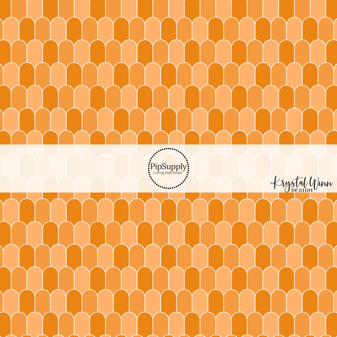 White outlined orange multi arches fabric by the yard