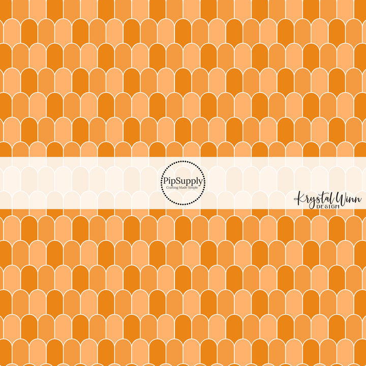 White outlined orange multi arches fabric by the yard