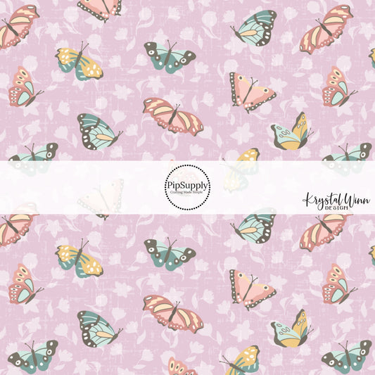 Butterfly print on purple fabric by the yard