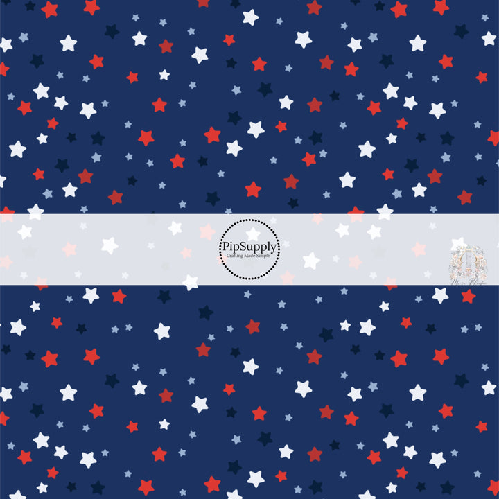 Navy blue fabric by the yard with red, white, and blue stars.