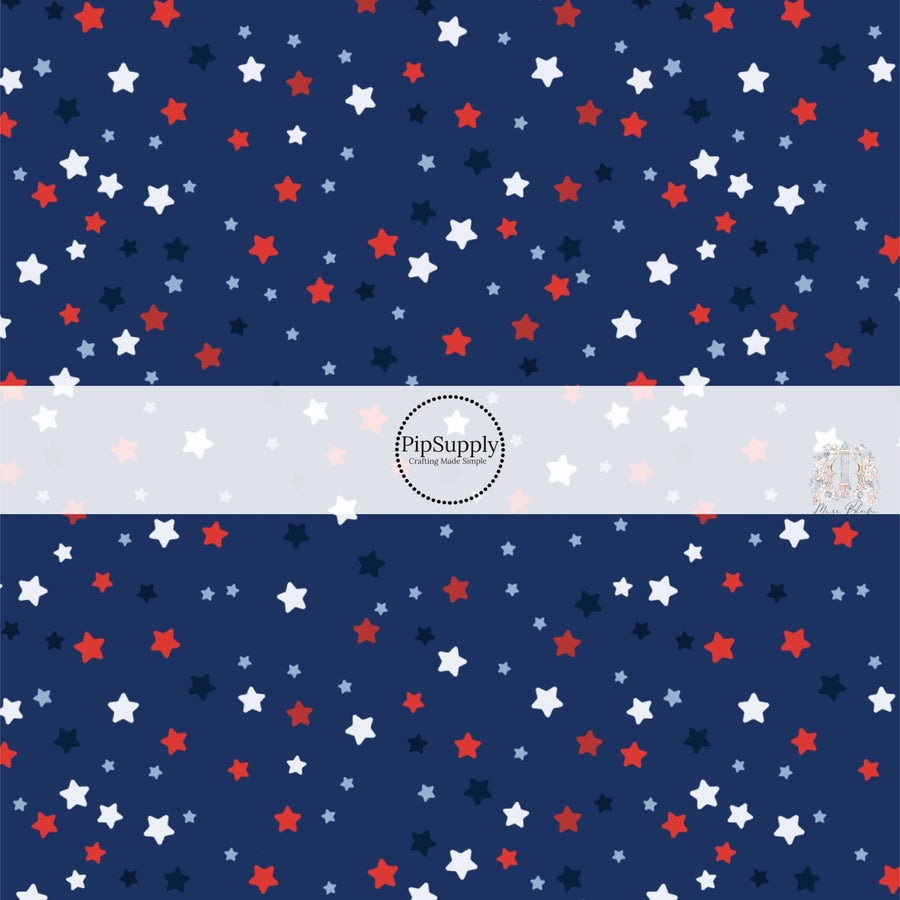 Navy blue fabric by the yard with red, white, and blue stars.