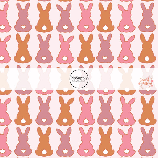 Light pink fabric by the yard with pink and orange bunnies with heart shaped tails - Spring Easter Fabric 