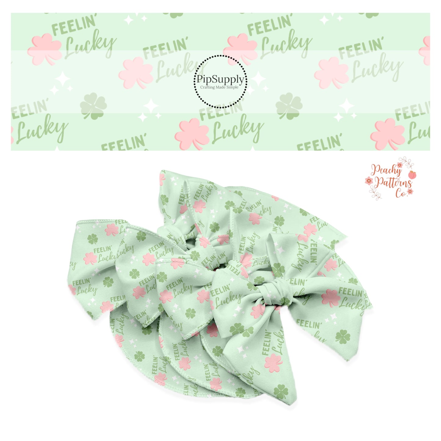Green tiny clovers with pink clovers and words that say "feelin' lucky" on a pastel green bow strip