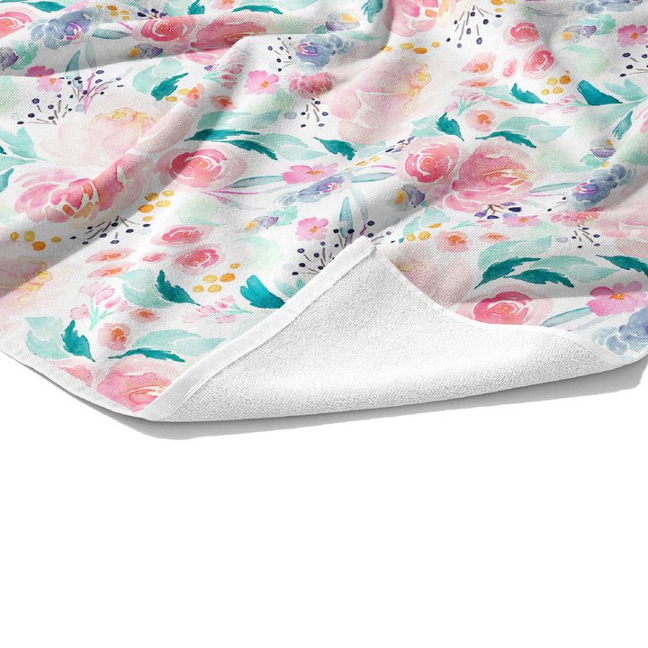 Plush white cotton customizable towel with aqua and pink watercolor floral patterned towel.