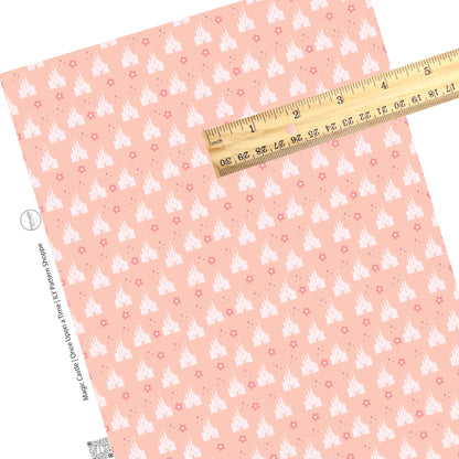Pink flowers and sparkles with light pink castles on a pink faux leather sheet